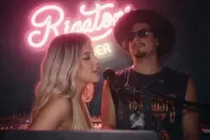 A woman sings into a microphone beside a man in sunglasses under a neon Rigatoni sign in Ibiza.