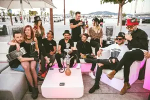 Vibrant nightlife scene at Zoo Bar Ibiza with laser lights