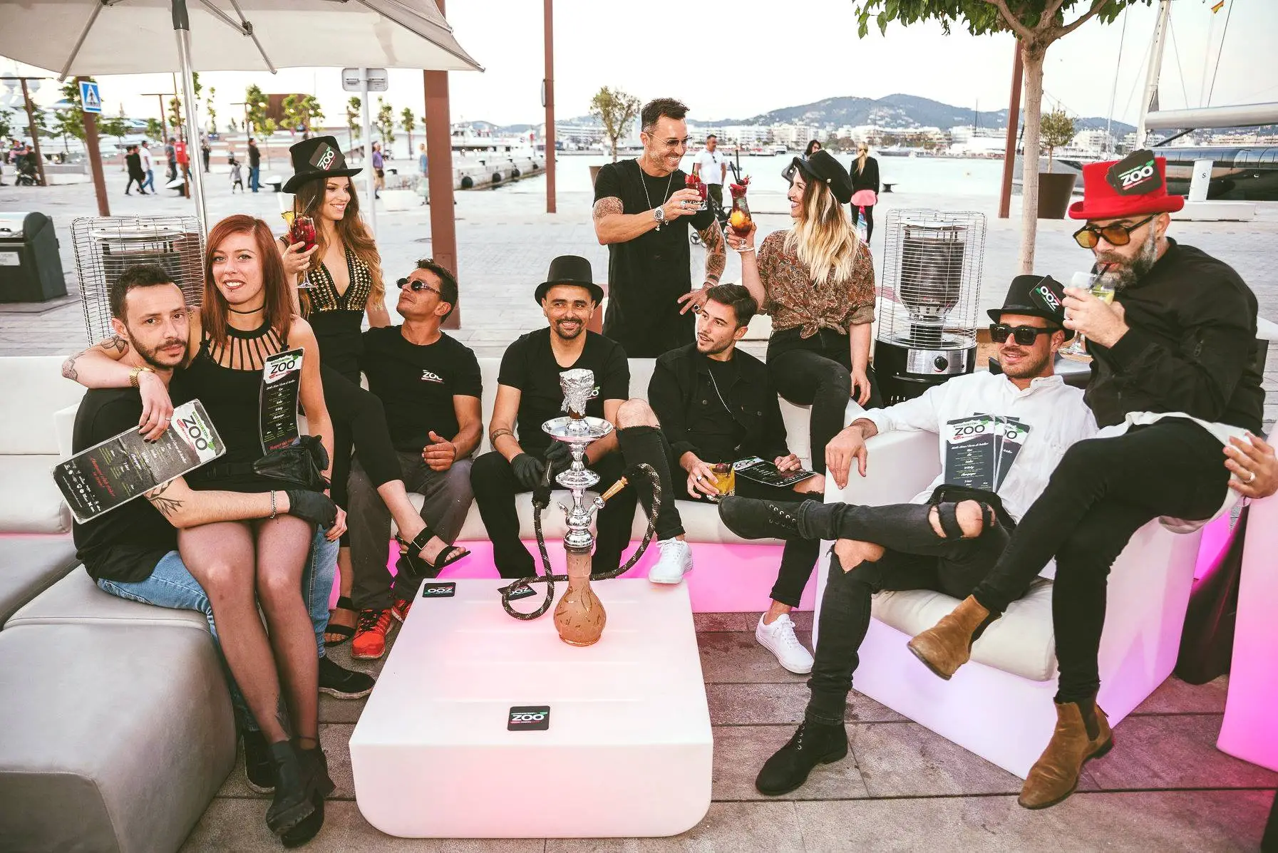 Vibrant nightlife scene at Zoo Bar Ibiza with laser lights