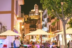 DJ performing at Zoo Bar Ibiza with packed dance floor