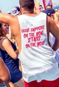 Man in a white tank top at a crowded Ibiza boat party outdoor gathering.
